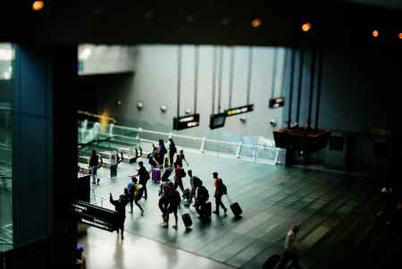 People Travelling at an Airport